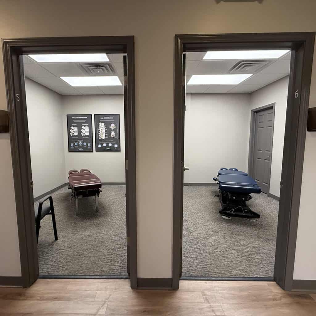 Chiropractic treatment rooms with massage tables at South Suburban Chiropractic Clinic.