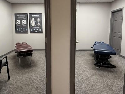 Chiropractic treatment rooms with adjustable tables at South Suburban Chiropractic Clinic.
