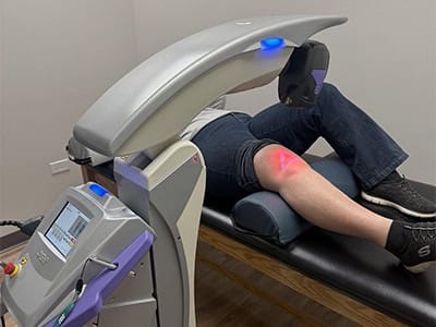 Chiropractic treatment for back pain using advanced therapy device.